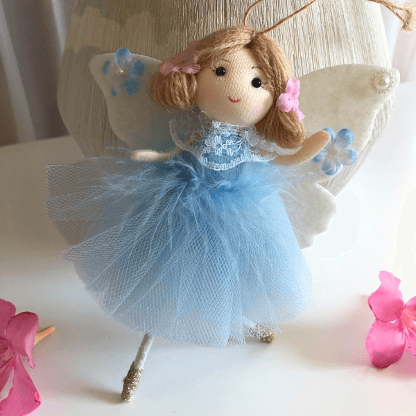 Handmade butterfly and flower dolls